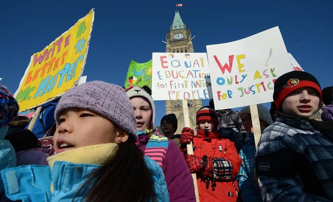 Children take part in a protest on Parliament Hill on Feb. 14, 2013, calling for equal education for First Nations.