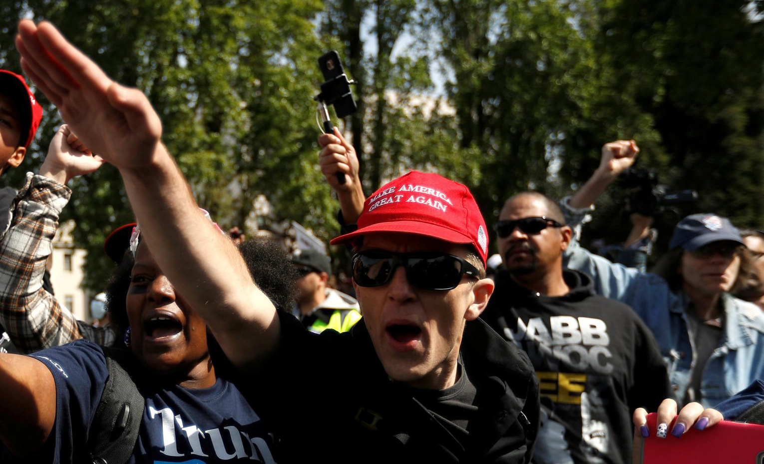 Demonstrators in support of U.S. President Donald Trump gesture during a rally in Berkeley, California.