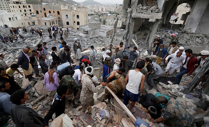 Local residents search through rubble following airstrikes that destroyed houses and killed at least a dozen in Sanaa, Yemen August 25, 2017.