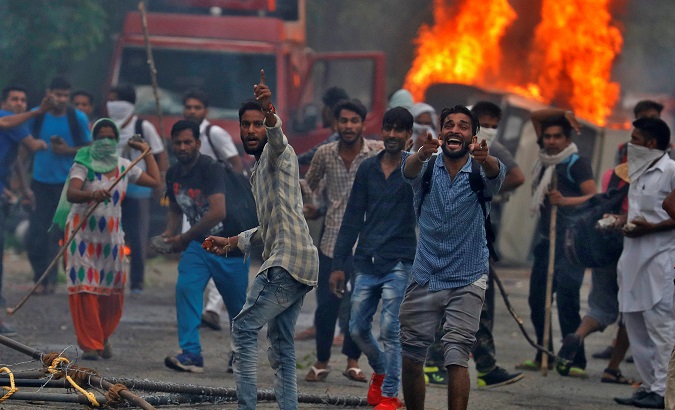 People on the streets during violence in the town of Panchkula, India, August 25, 2017