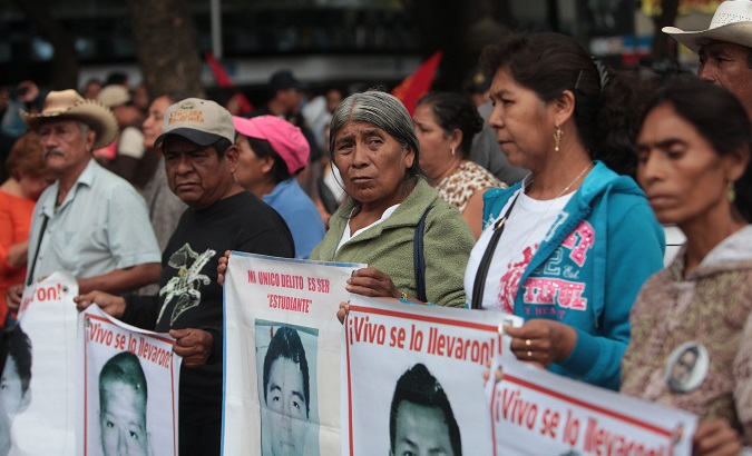 Relatives of the 43 disappeared students of Ayotzinapa during a march in Mexico City