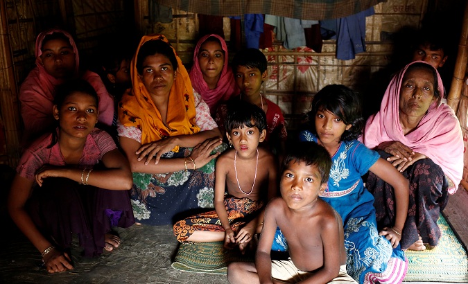 A group of Rohingya refugees takes shelter at the Kutuupalang makeshift refugee camp in Cox’s Bazar, Bangladesh, on August 26, 2017.