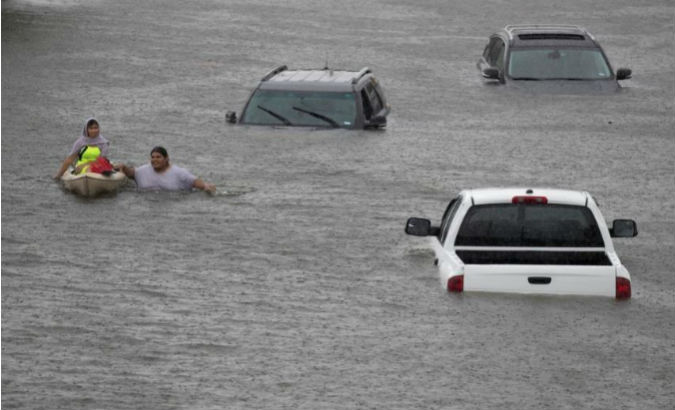 Jesus Rodriguez rescues Gloria Garcia in Pearland, in the outskirts of Houston.