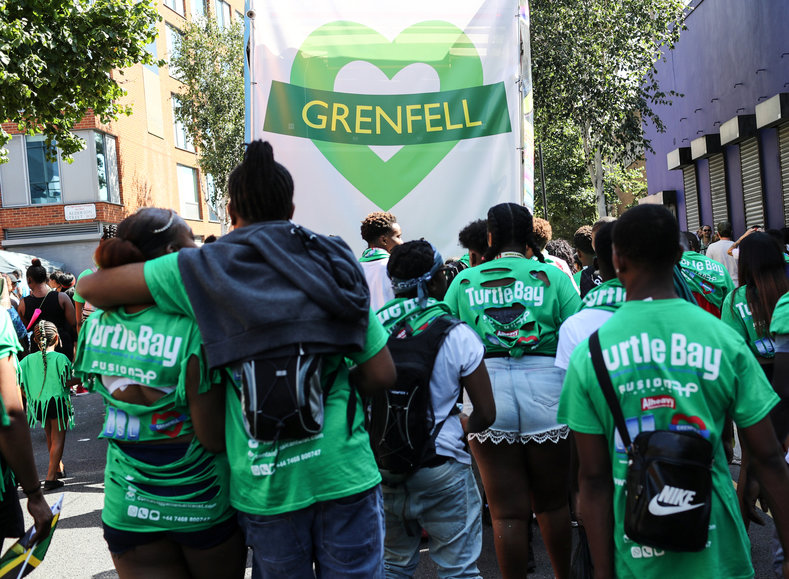 The Grenfell Tower that was destroyed by fire earlier this year is in the Notting Hill area. The organizers encouraged people to wear green as a tribute.