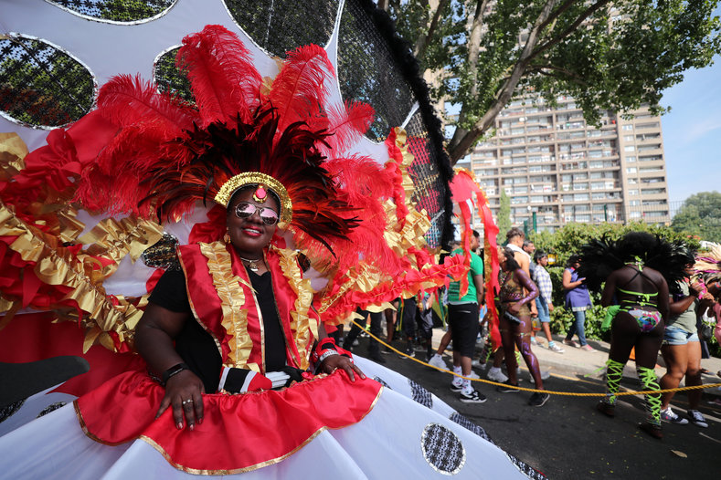 A costumed masquerader along the parade route.