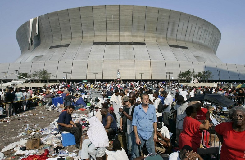 Thousands of Hurricane Katrina survivors wait to be evacuated from the Superdome in New Orleans September 2, 2005. After five days of surviving Hurricane Katrina, New Orleans residents were finally evacuated from the sports stadium by authorities.