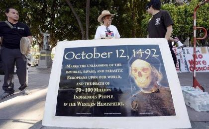 Olin Tezcatlipoca of the Mexica Movement stands with fellow protesters in an action against Father Junipero Serra.