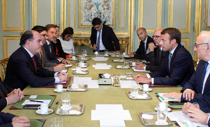 Macron talks with Borges and Guevara during a meeting at the Elysee Palace in Paris, September 4.