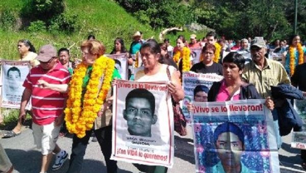 Families of the 43 students march in Mexico.