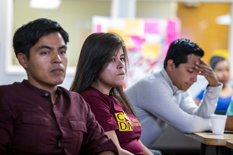 Young DACA recipients, Mario, Melanie and Luis, watch U.S. Attorney General Jeff Sessions' announcement on the Deferred Action for Childhood Arrivals (DACA) program, on a projection screen at the Coalition for Humane Immigrant Rights of Los Angeles (CHIRLA) headquarters in Los Angeles, California, Sept. 5, 2017. 