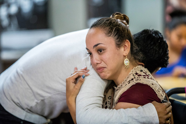 Paulina, 26, a DACA recipient, is comforted after watching the U.S. Attorney General's announcement on the Deferred Action for Childhood Arrivals (DACA) program on a screen at the Coalition for Humane Immigrant Rights of Los Angeles in Los Angeles, California, U.S., September 5, 2017. Paulina, a graduate of UCLA, arrived in the U.S. when she was 6 years old. She said the decision was really upsetting but she was going to continue to work to push members of Congress to enact a law to protect their rights. 