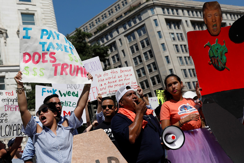 Protestors gather outside the Trump International Hotel in Washington D.C. to protest President Donald Trump's plan to repeal DACA, Sept. 5, 2017. 