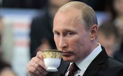 Russian President Vladimir Putin sips a hot cup of tea. (FILE)