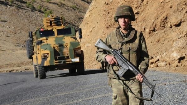 Turkish soldiers patrol a road near Uludere in the Sirnak province, southeastern Turkey. 