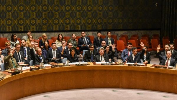 Ambassadors to the U.N. vote during a United Nations Security Council meeting on North Korea in New York City, U.S., Sept. 11, 2017.