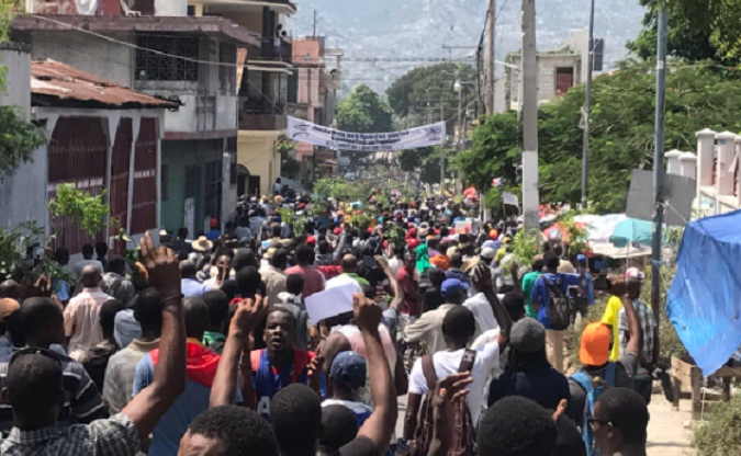 Hundreds of people protest the budget for next year in Port-au-Prince.