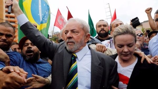 Lula arrives in court to testify before Judge Sergio Moro in May.