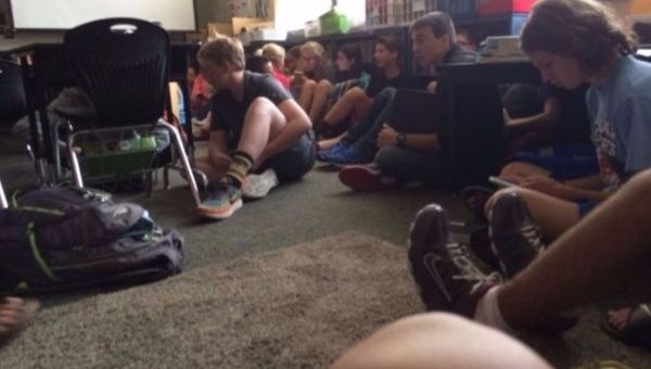 Students sit on the floor during an active shooting at Freeman High School in the U.S. state of Washington.
