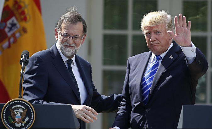 U.S. President Donald Trump (L) and Spanish Prime Minister Mariano Rajoy (L) give a joint news conference at the White House.