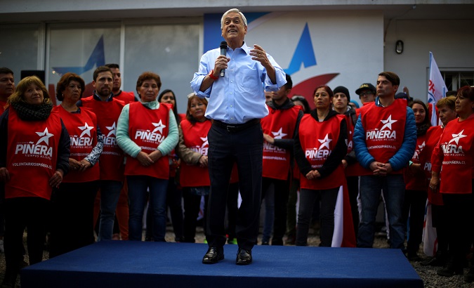 Former Chilean President Sebastian Piñera delivers a speech during a campaign rally in Santiago.