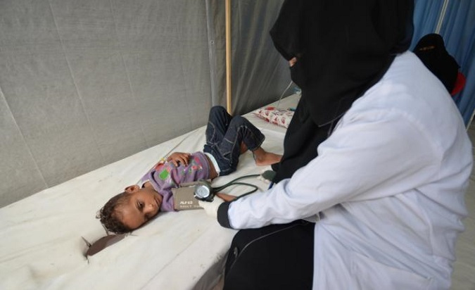 A child suffering from cholera, which causes life-threatening dehydration, is treated in Yemen.