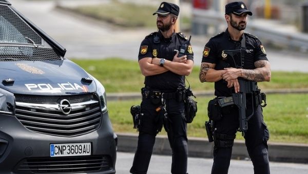 Spanish national police officers stand guard outside a port before the October 1 independence referendum, in Barcelona.