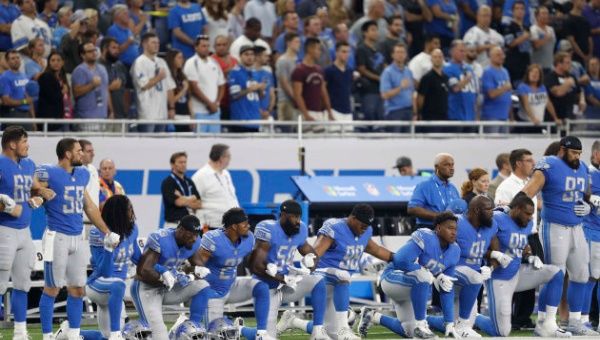 Detroit Lions players kneeling during the national anthem last Sunday.