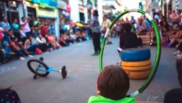 A child watches a street performance in Loja, Ecuador.