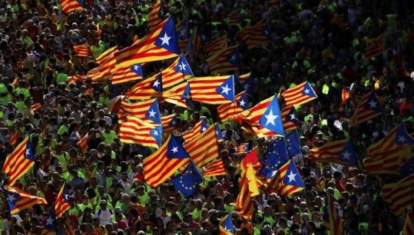 Esteladas (Catalan separatist flags) are waved as thousands of people gather for a rally on Catalonia's national day 'La Diada' in Barcelona, Spain.