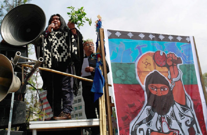 Mapuche Indian activist Victor Queipul delivers a speech against Columbus Day during a rally in downtown Santiago