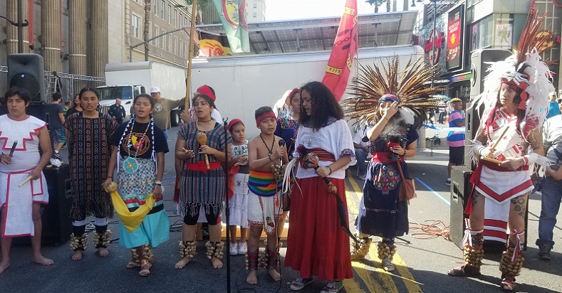 Ralliers demonstrating in the streets of Los Angeles, California for Indigenous People's Day honor Native American activist Leonard Peltier.