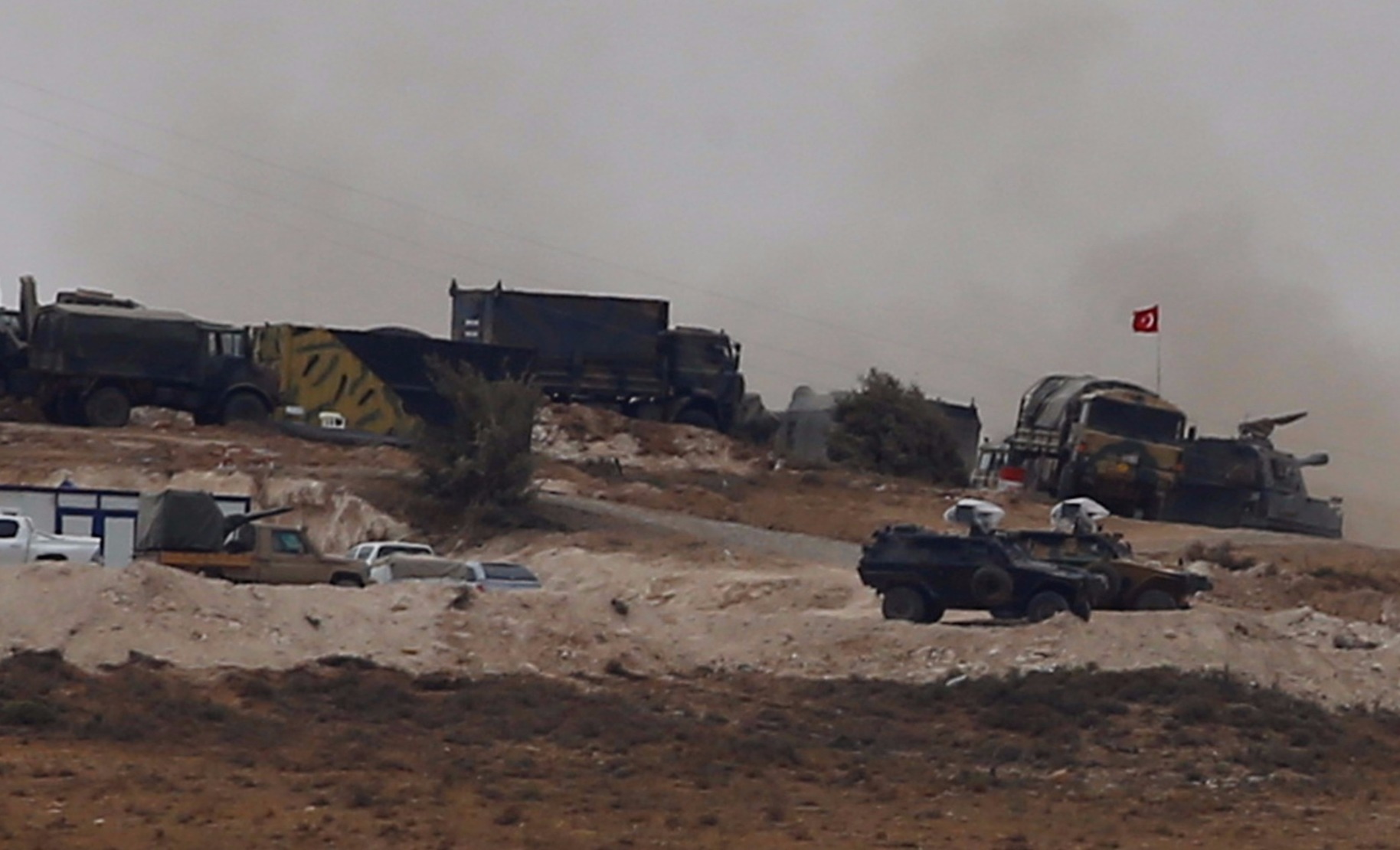 Turkish military vehicles are seen on the Turkish-Syrian border line in Reyhanli, Hatay province, Turkey, Oct. 9, 2017.