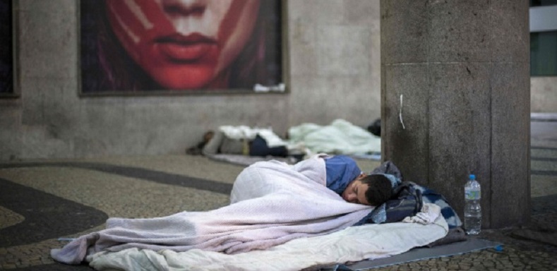 A homeless man sleeping in Rio de Janeiro.
