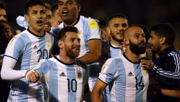 Argentina's Lionel Messi, Javier Mascherano (14) and other teammates celebrate at the end of the match.