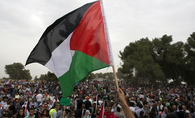 Illustrative photo of a protester holding up a Palestinian flag.