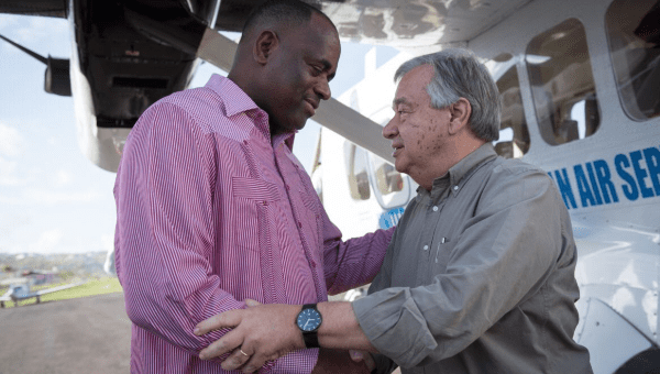 Dominica's President Roosevelt Skerrit (L) greets the UN Secretary General Antonio Guterres (R) during his visit to discuss the recovery efforts.