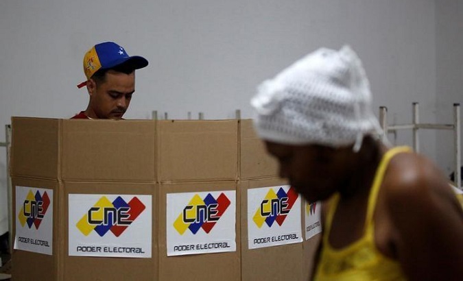 A man casts his vote at a polling station during the Constituent Assembly election in Caracas, Venezuela.