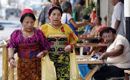 Indigenous women walk through the streets of Panama City.