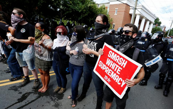 A few dozen Ku Klux Klan members and supporters shouted “white power” at a rally on Saturday in Charlottesville, Virginia where they protested against a city council decision to remove a statute honoring Confederate General Robert E. Lee.