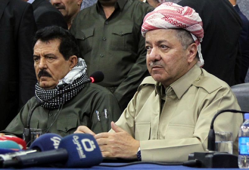 Iraqi Kurdistan's regional president Massud Barzani (R) attending an assembly with vice president Kosrat Rasul (L)