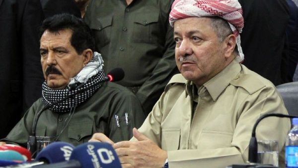 Iraqi Kurdistan's regional president Massud Barzani (R) attending an assembly with vice president Kosrat Rasul (L) 