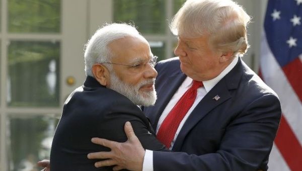 India’s Prime Minister Narendra Modi hugs President Donald Trump as they give joint statements in the Rose Garden of the White House in Washington.
