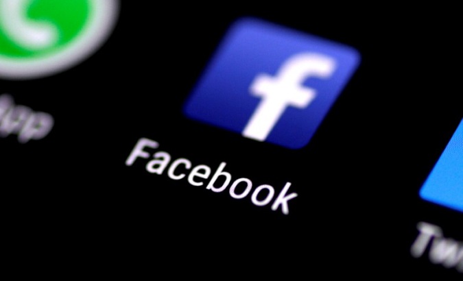 The Facebook app is seen on the screen of a mobile phone as the social media network denies 'listening in' on users' live conversations.