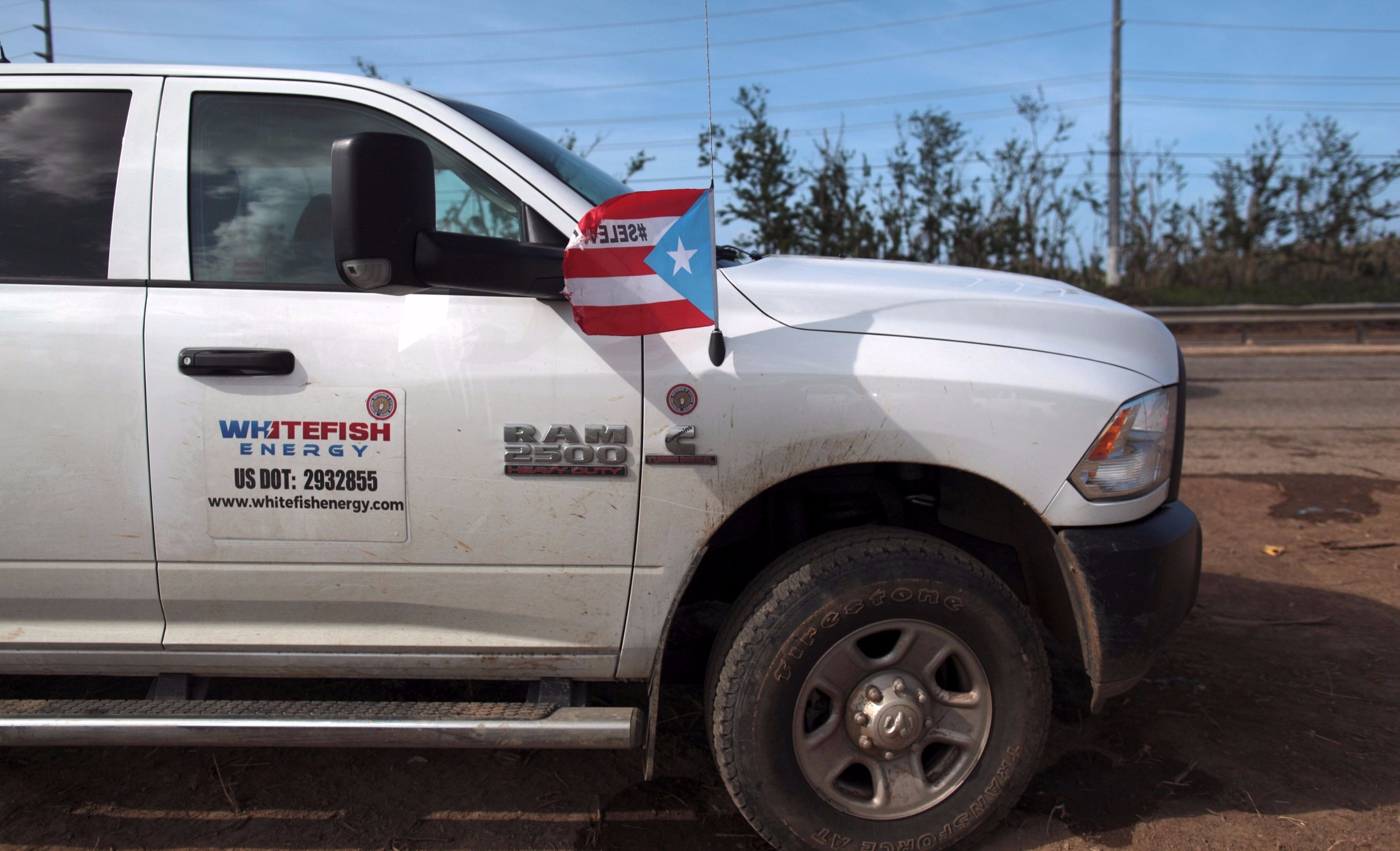 A pickup truck from Montana-based Whitefish Energy Holdings is parked in Manati, Puerto Rico Oct. 25, 2017.