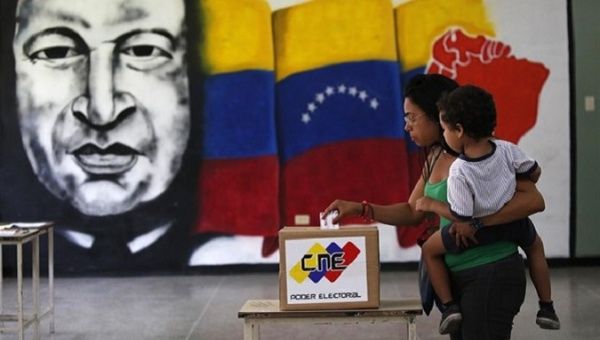 A woman votes in Venezuela.