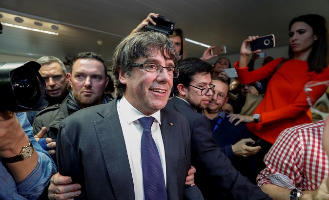Catalan leader Carles Puigdemont departs after giving a news conference at the Press Club Brussels Europe in Brussels, Belgium, Oct. 31, 2017.