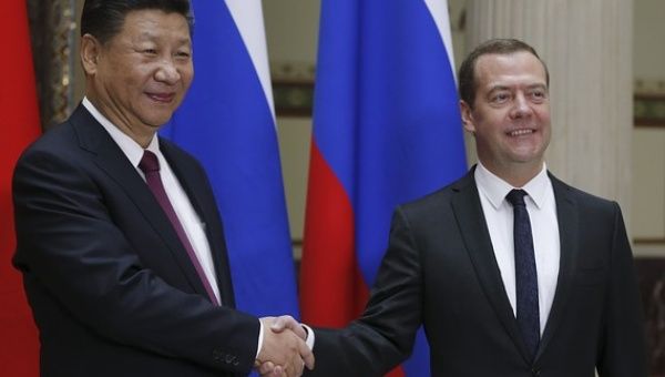 Medvedev (R) has met with Xi (L) five times in as many years.