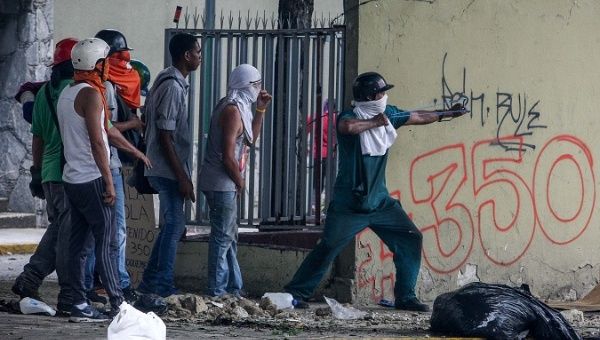  Protesters face the authorities, June 5, 2017, during a protest in Venezuela