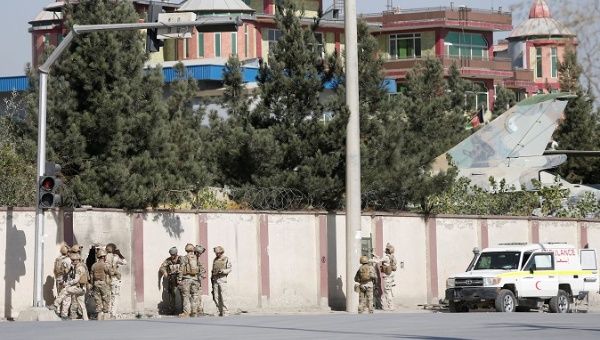 Afghan security forces take position in front of a private television station after it was attacked in Kabul, Afghanistan, November 7, 2017.