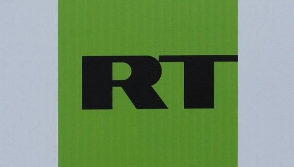 The logo of Russian television network Russia Today (RT) is seen on a board at the St. Petersburg International Economic Forum 2017 (SPIEF 2017) in St. Petersburg, Russia, June 1, 2017.